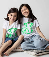 niñas-camiseta-blanca-mono-verde